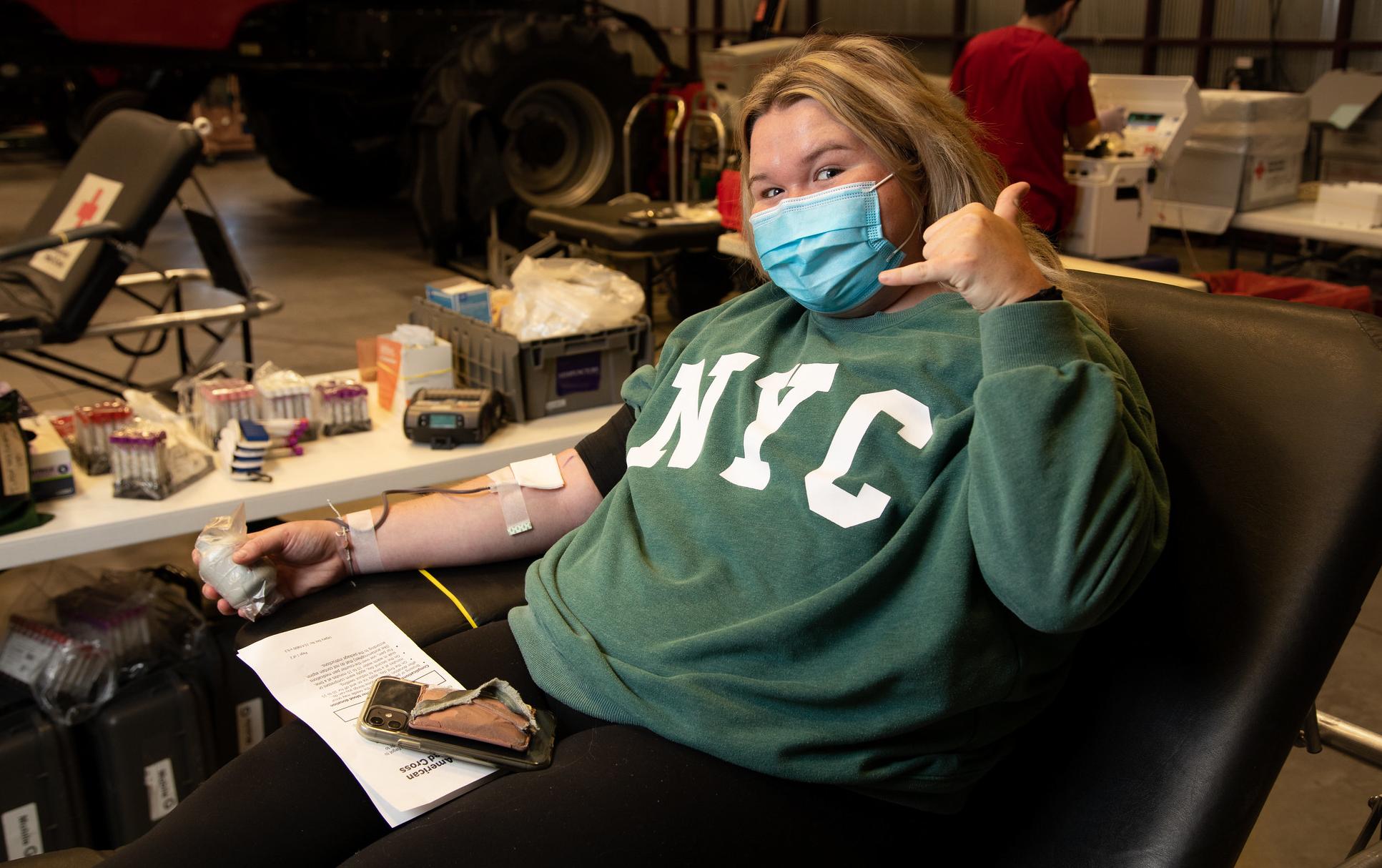 a student donates blood