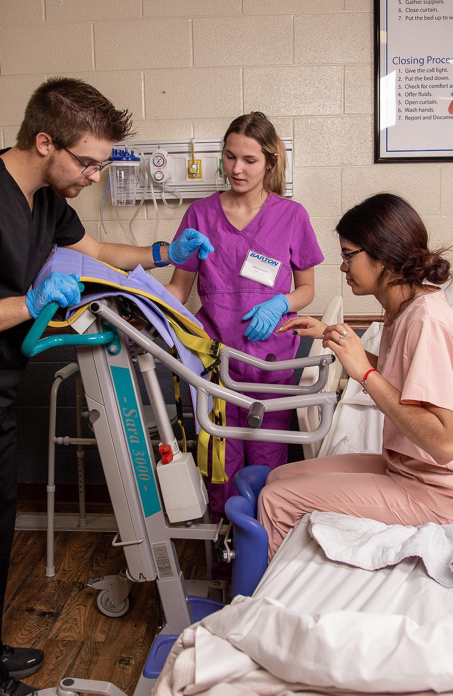 students practicing moving a patient