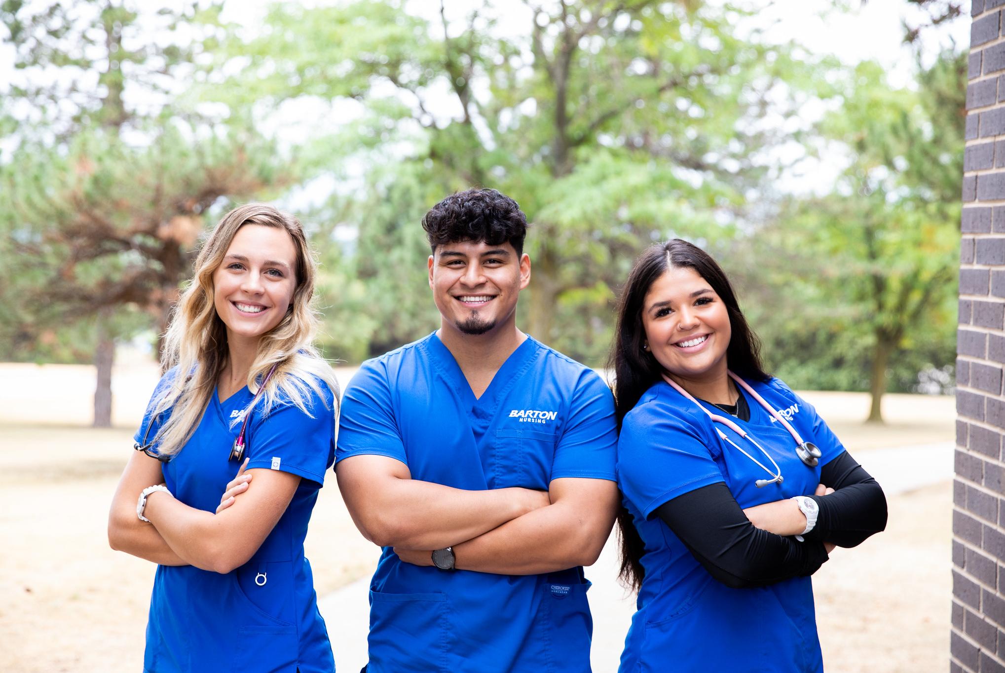 three nursing students standing