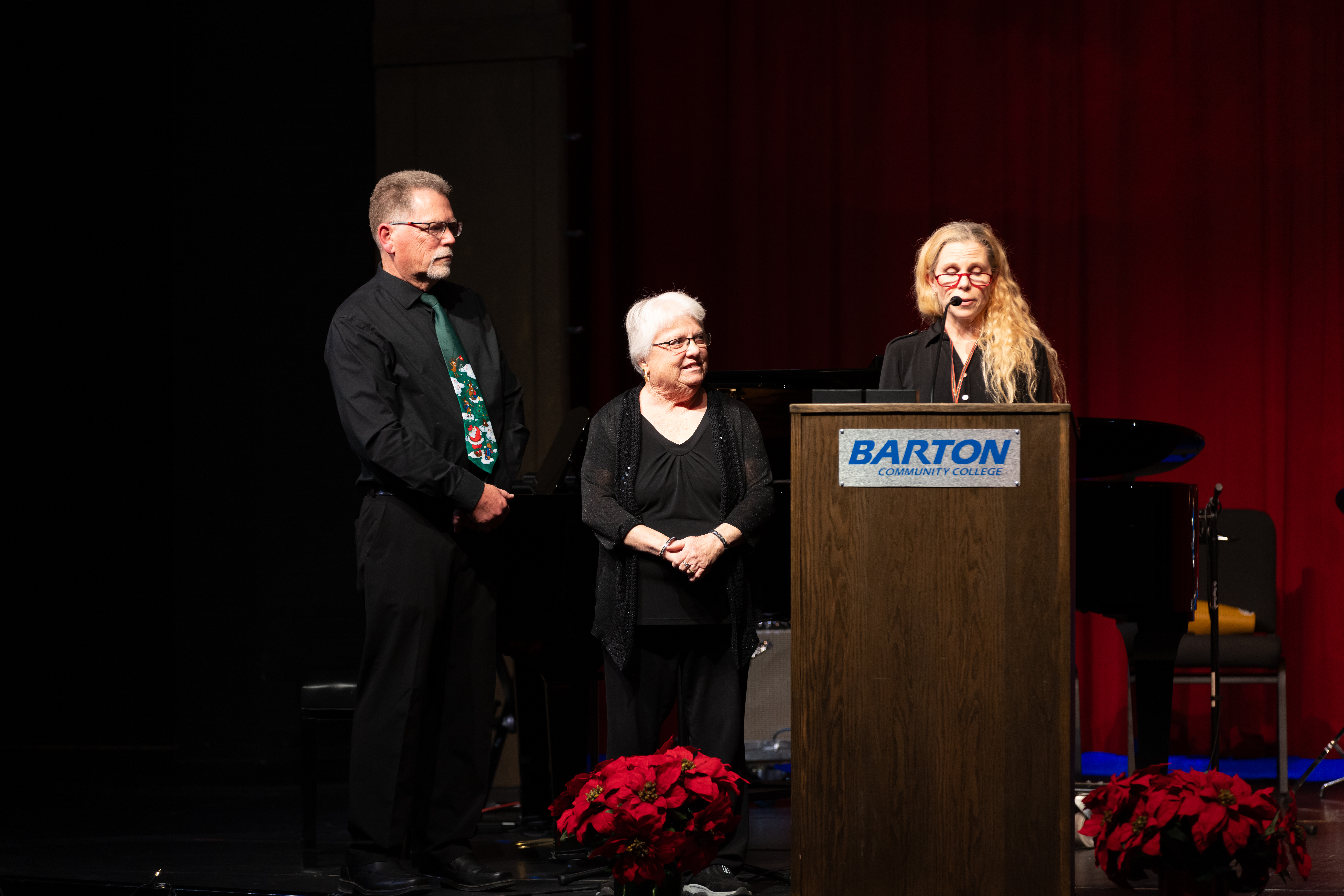 Fine and Performing Arts Coordinator and Instructor of Dance Danika Bielek (right) presents the newly established Hall of Fame award to Marc Webster and Denise Shoff (from left), the children of the late JB Webster, at Barton’s Holiday Concert in December. As the Director of Instrumental Music, Webster dedicated his life to music education and higher education governance.