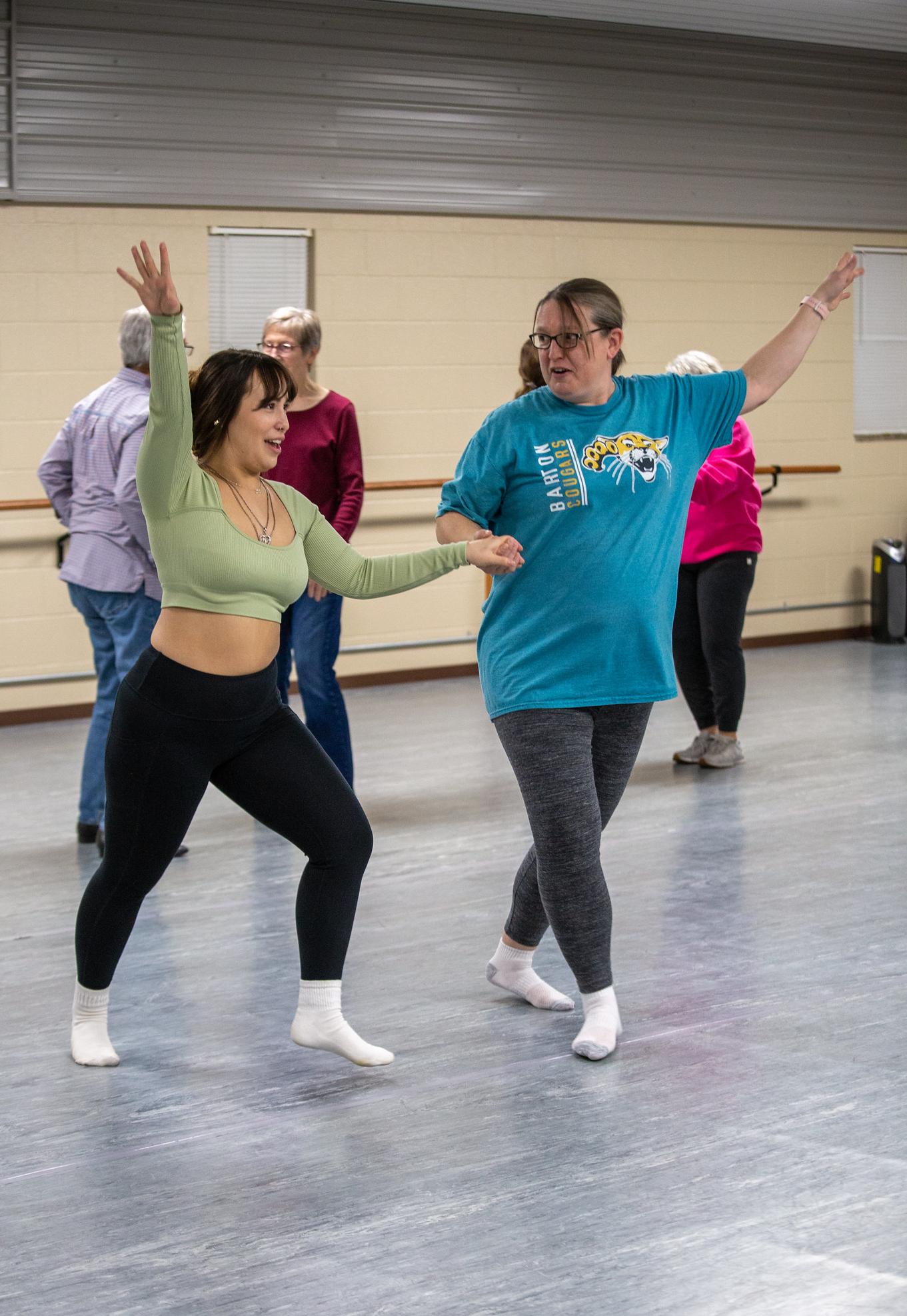 two people dancing and smiling