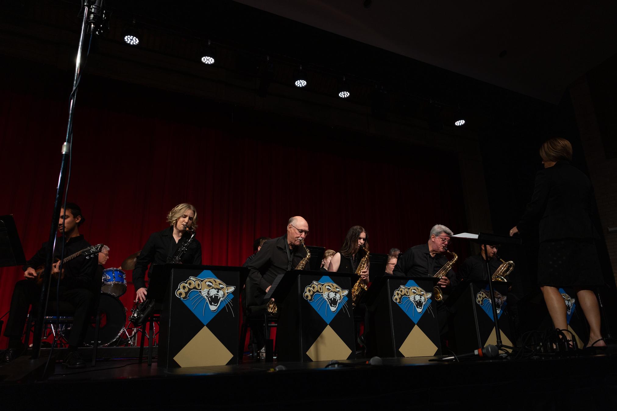 musicians playing on a stage