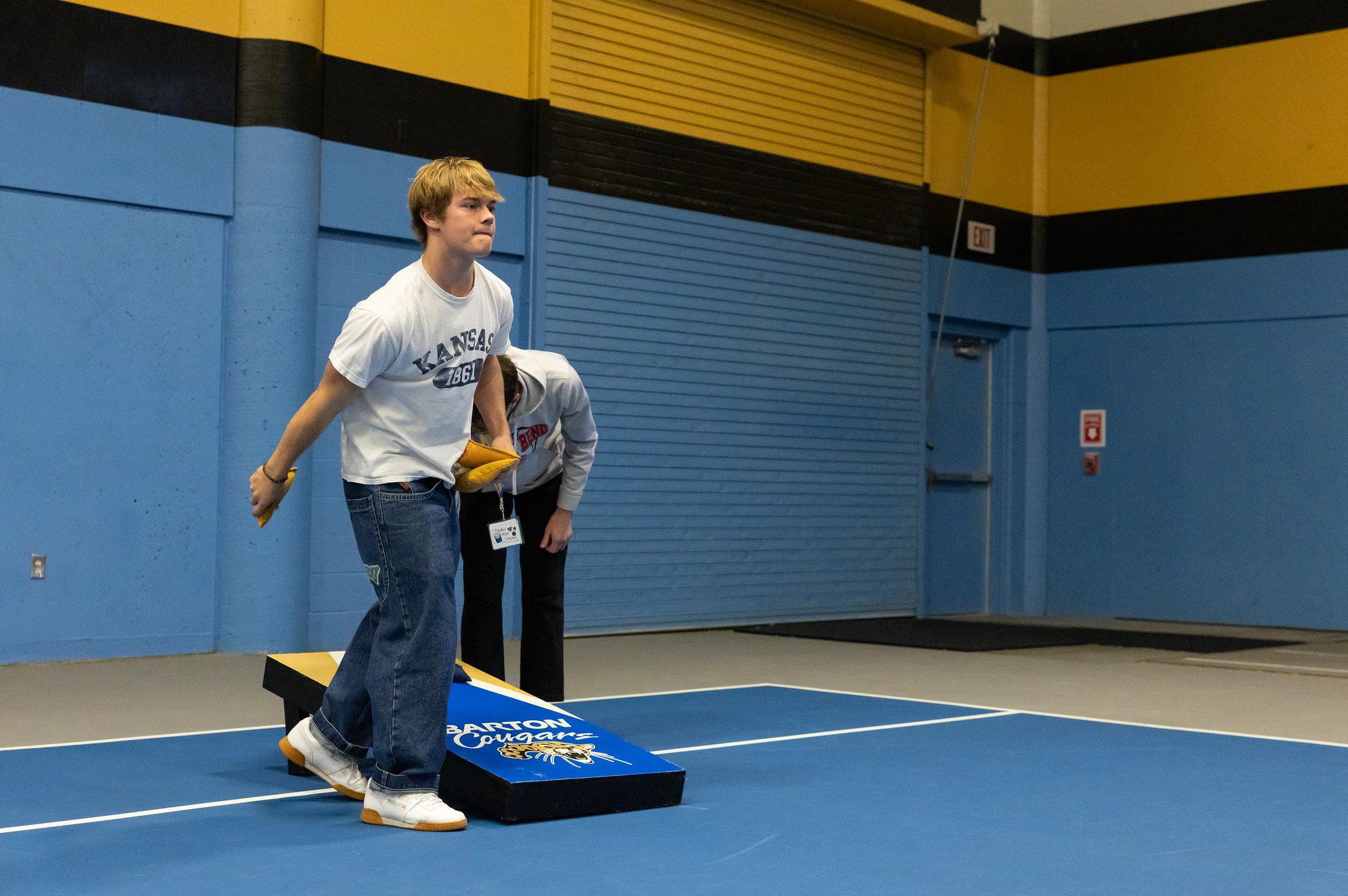 students playing cornhole