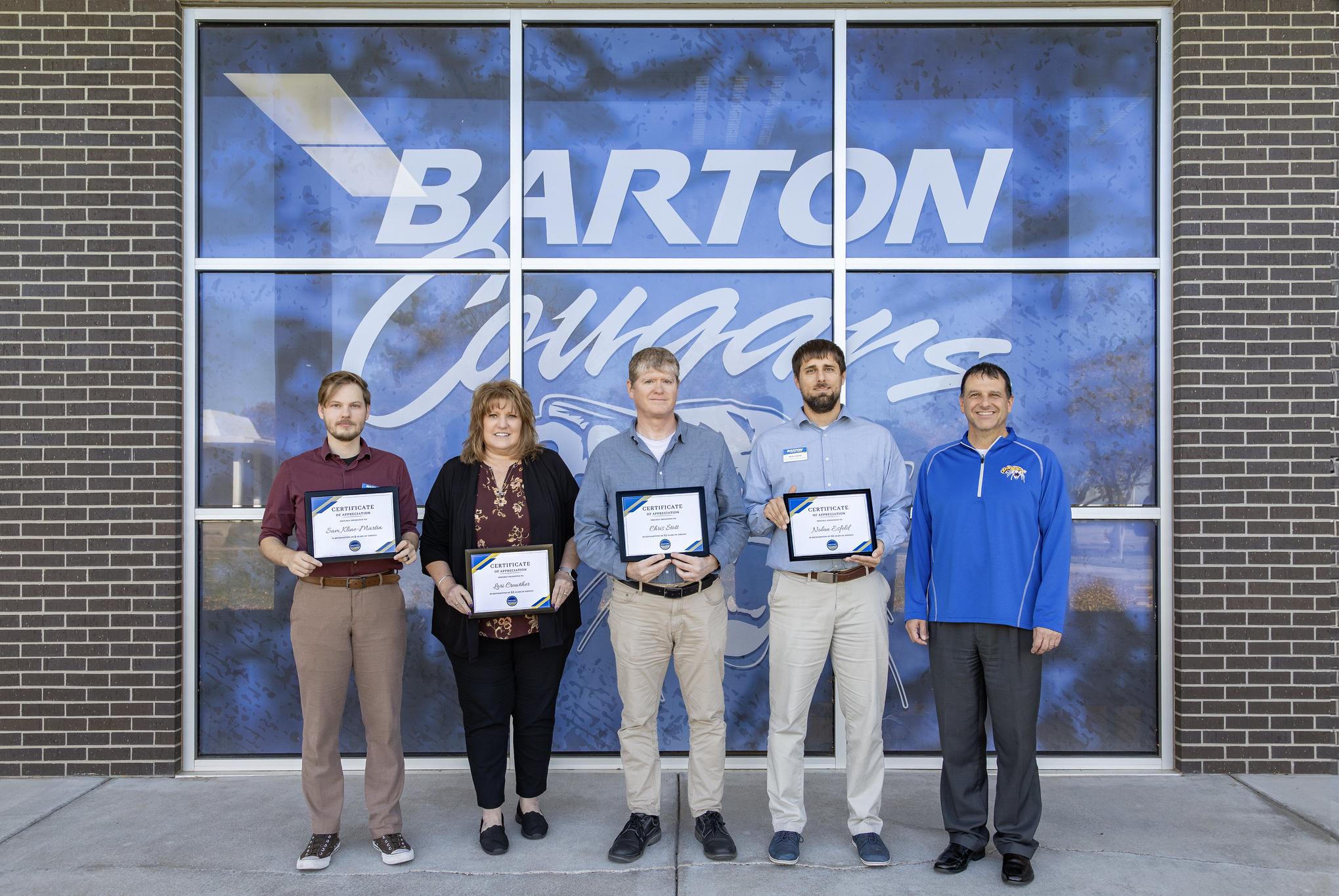 people holding certificates