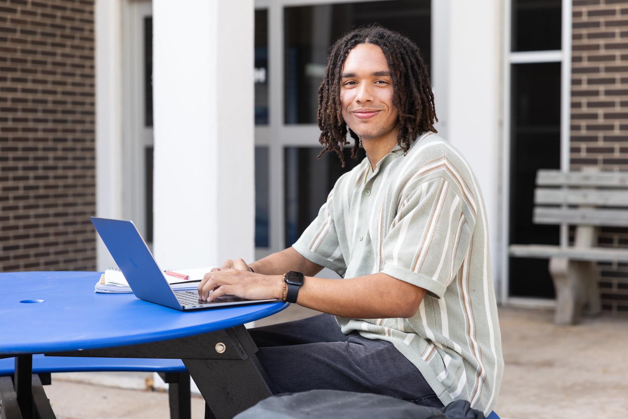 student smiling at camera
