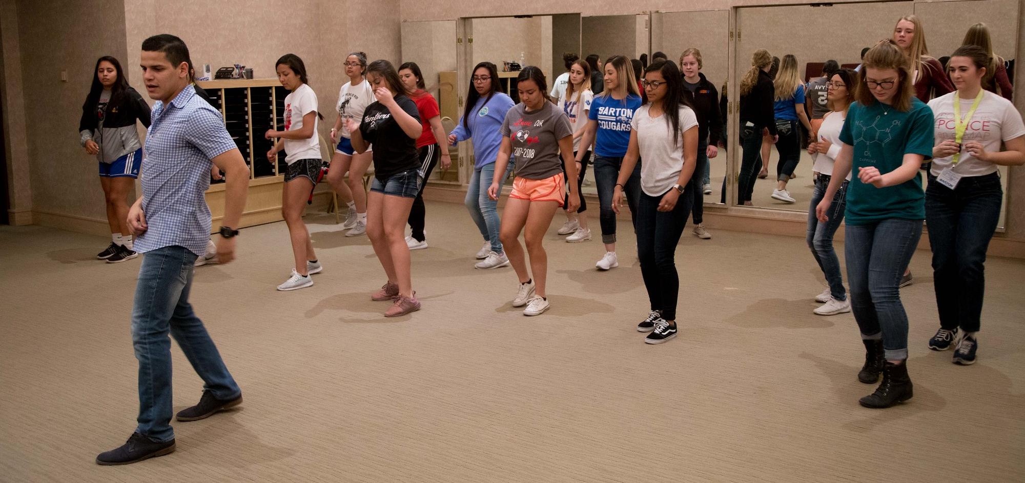 students learning Latin dancing