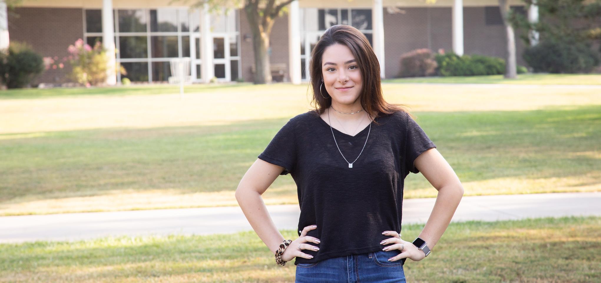 Student smiles on campus